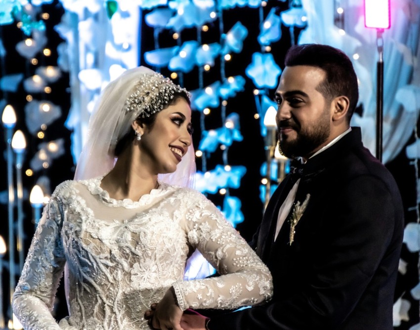 a man and a woman standing next to each other