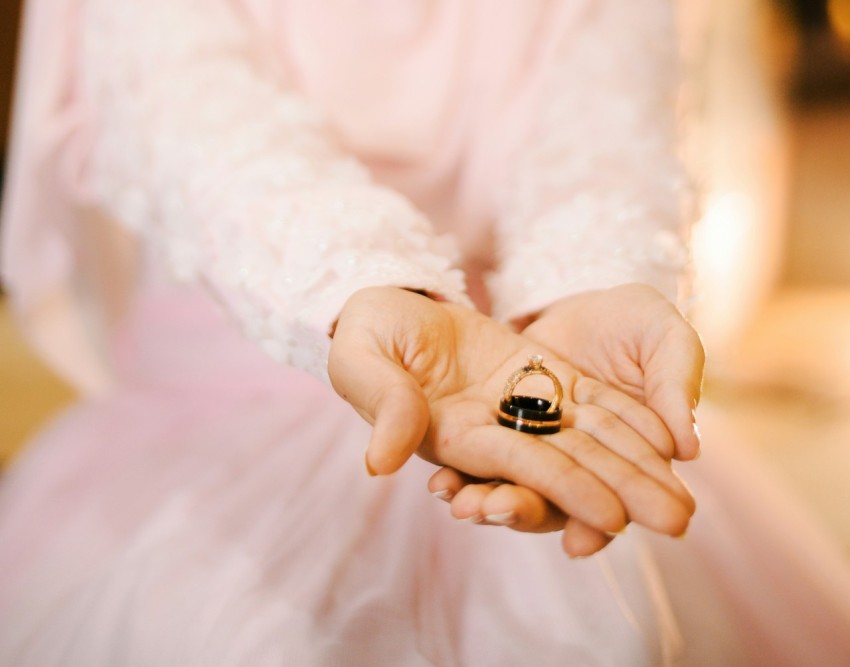 person holding black stone fragment