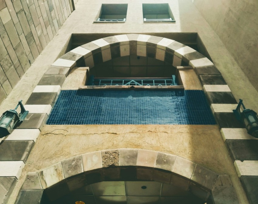 a building with a pool in the middle of it