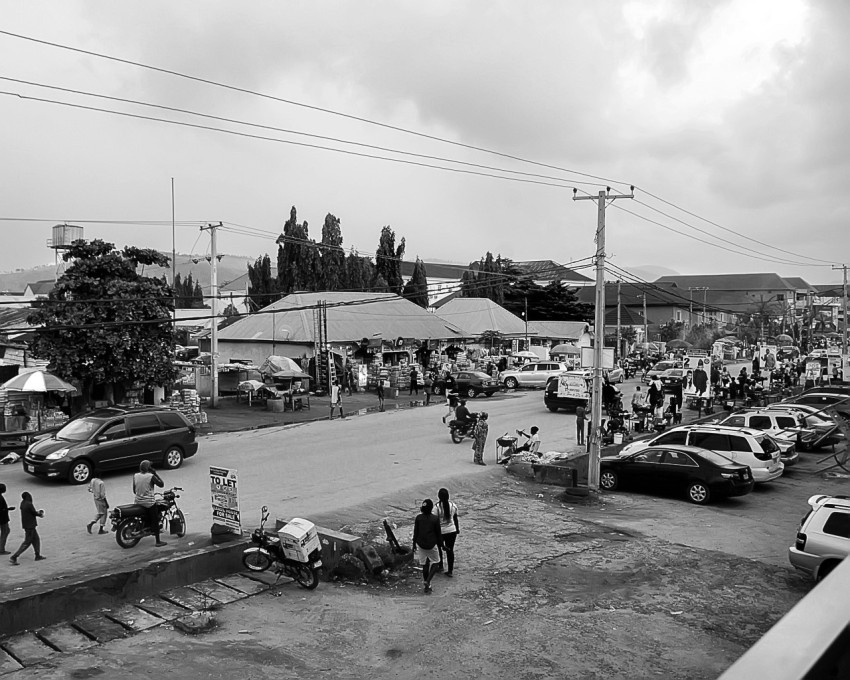 a street with cars and people