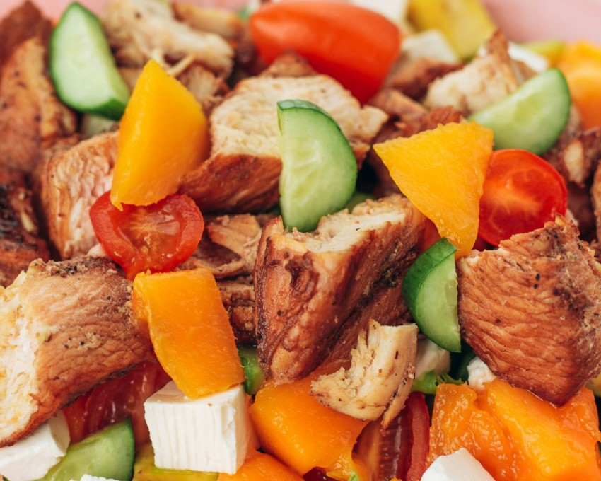 a close up of a plate of food with meat and veggies 7Pq17MPIM