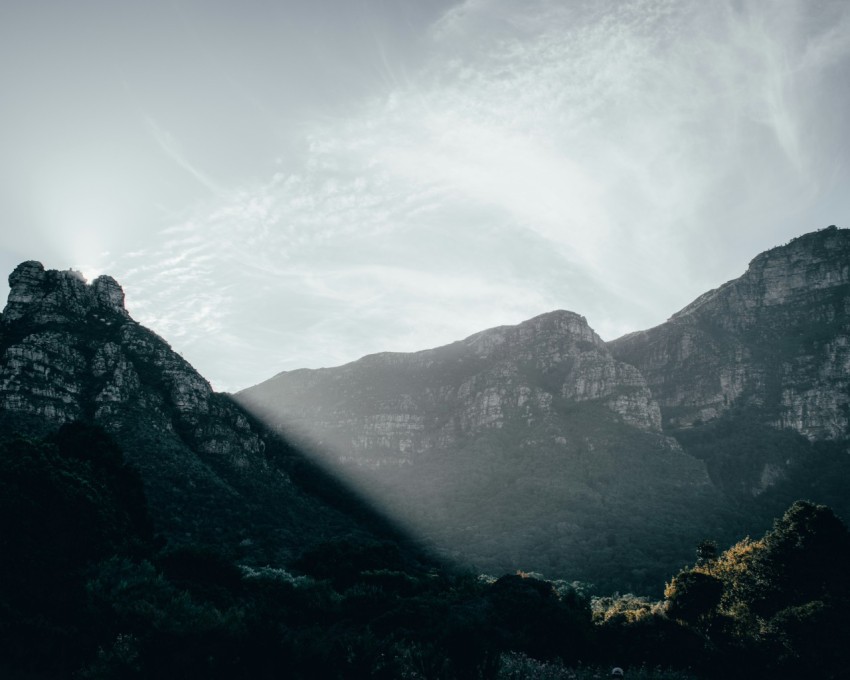 green mountains under white clouds during daytime