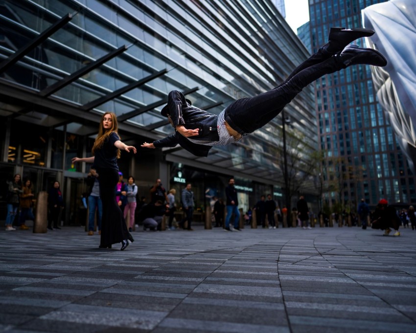 a man flying through the air while riding a skateboard