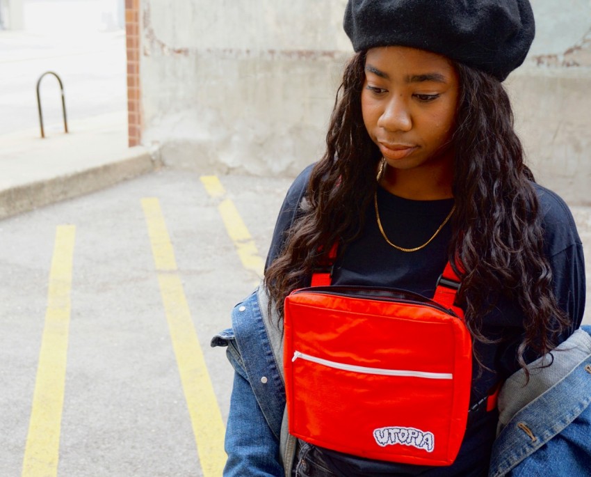 woman carying red bag