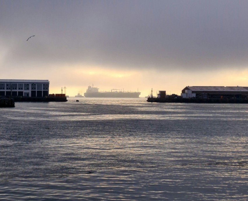 a body of water with a large ship in the distance