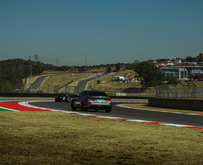 a police car driving down a race track