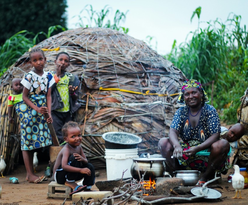 a group of people sitting around a fire pit