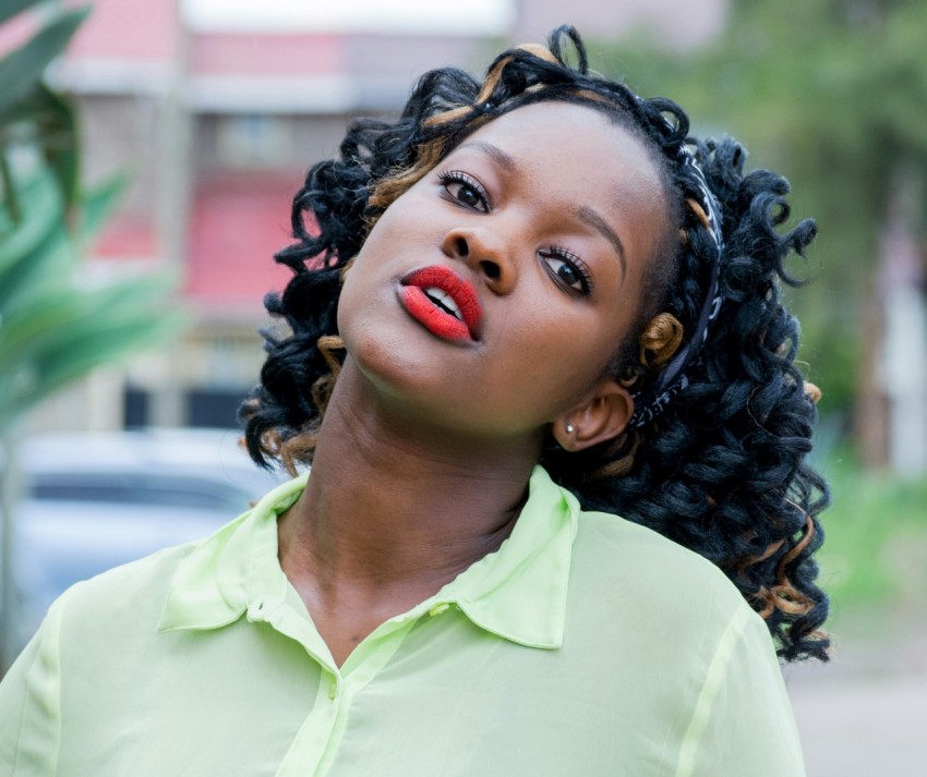 woman wearing green collared shirt