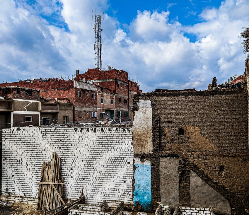 brown brick building under blue sky during daytime