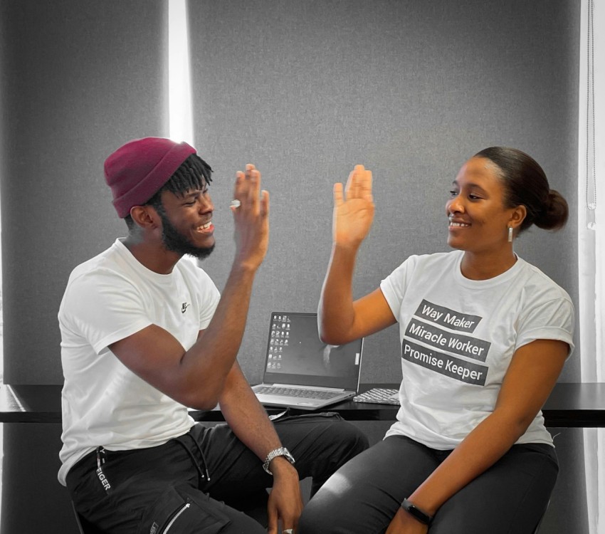 a man and a woman sitting on a table