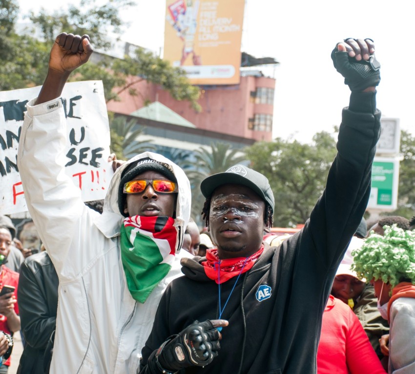 a couple of people that are holding up signs