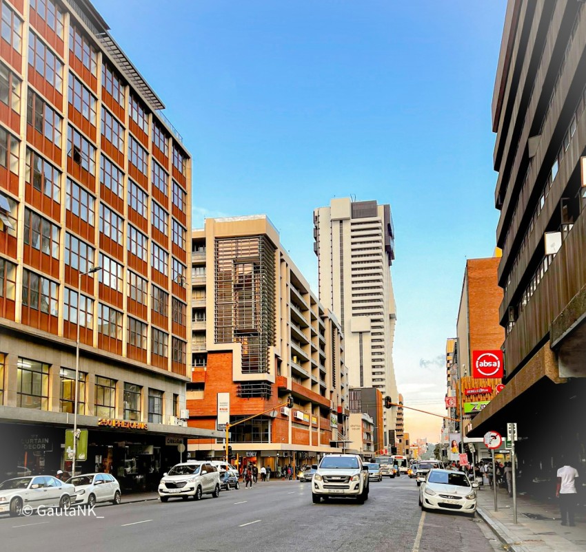 a city street filled with lots of tall buildings