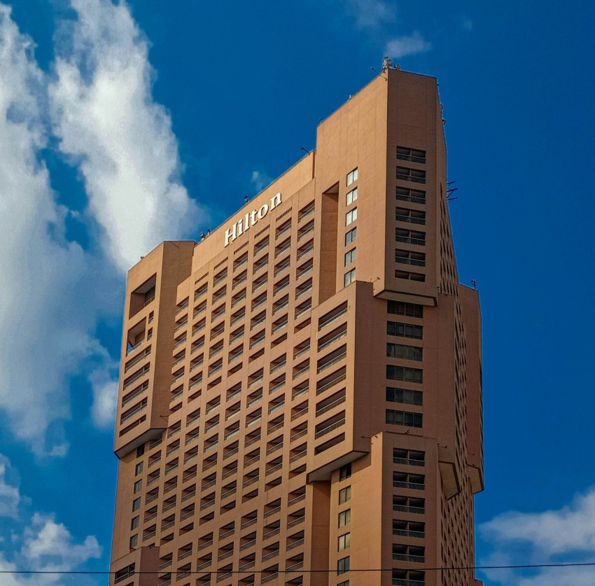 a tall building with a blue sky