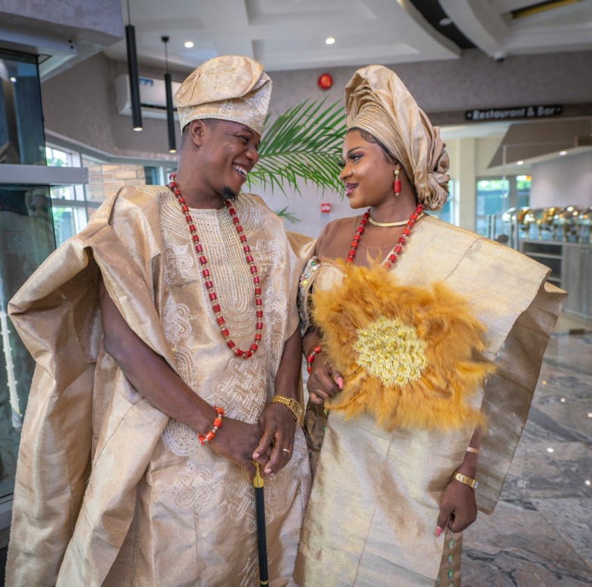 a man and woman wearing traditional clothing