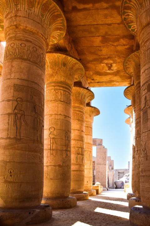 a group of statues in a stone building