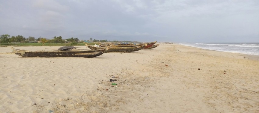 a group of boats on a beach