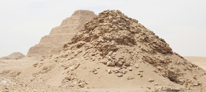 a large pile of rocks sitting in the middle of a desert