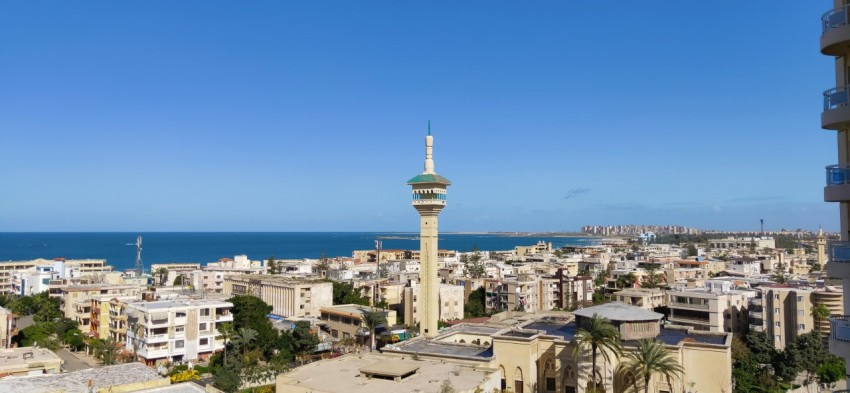 a view of a city with a tower in the middle