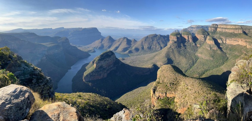 a view of a mountain range with a body of water in the distance