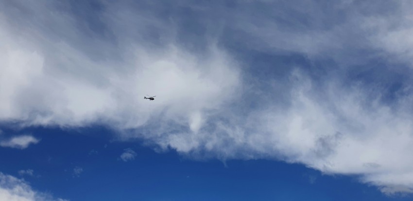 black helicopter on sky during daytime