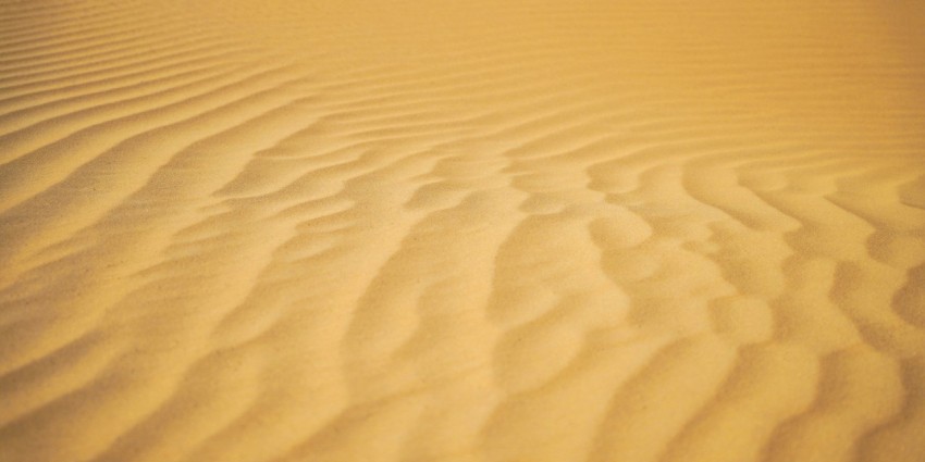 a sandy area with a few lines in the sand