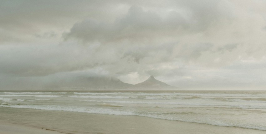 ocean waves crashing on shore during daytime