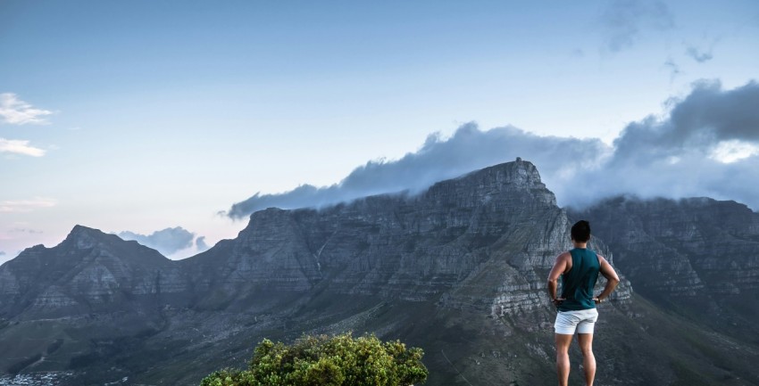 man standing on cliff