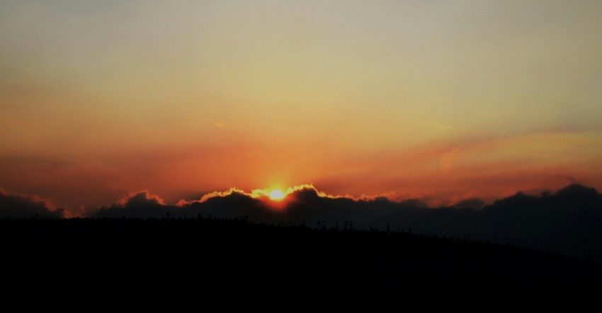 silhouette of mountain during sunset