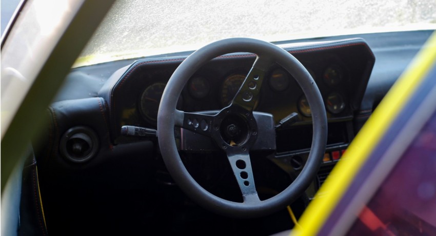 black and yellow steering wheel