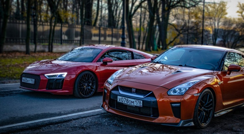 two cars parked side by side on a road