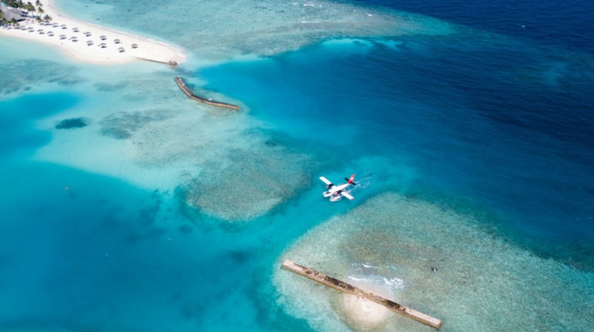 top view of white plane on body of water gUQp0w3