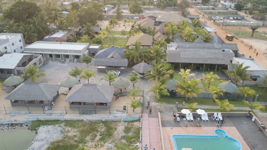 an aerial view of a resort with a pool