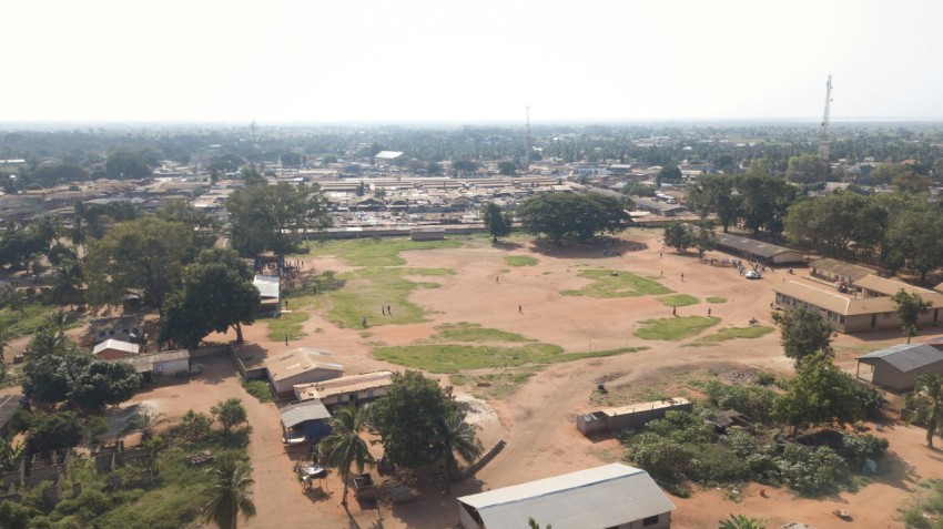 an aerial view of a small town with a lot of trees