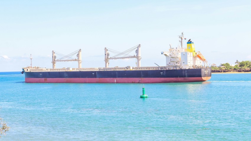 a large cargo ship in the middle of the ocean