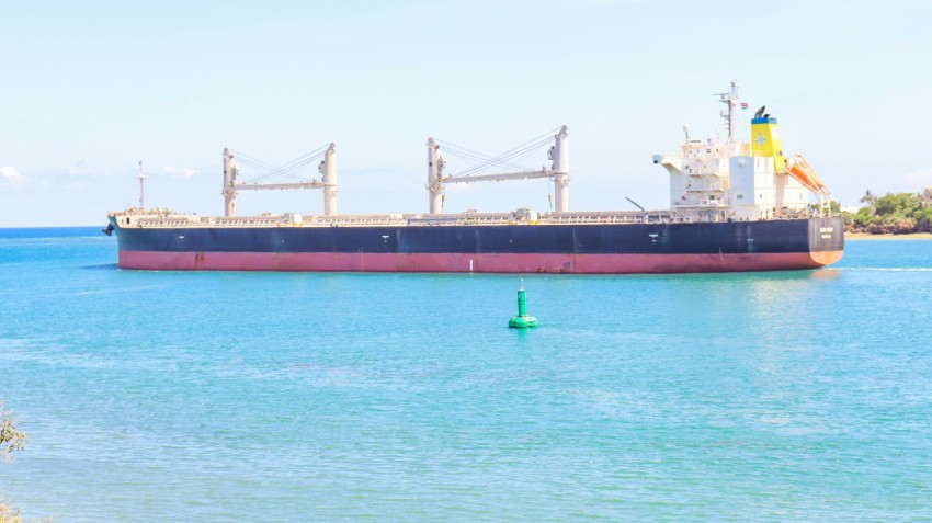 a large cargo ship in the middle of the ocean IT