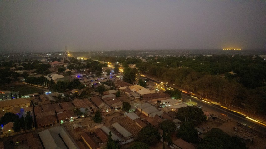 an aerial view of a city at night WeEu