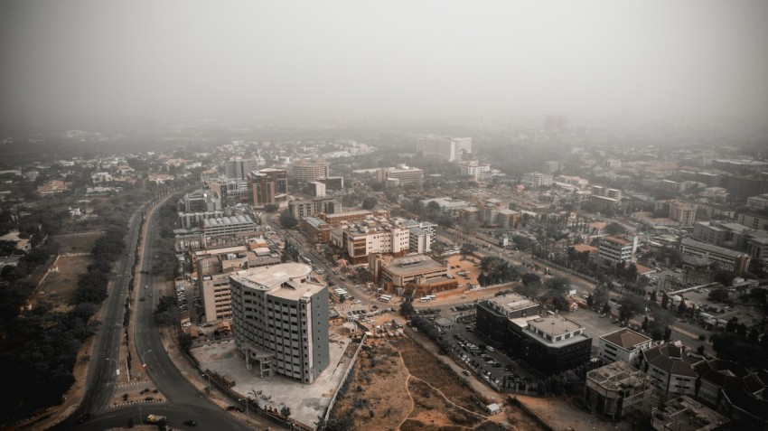 an aerial view of a city in the fog