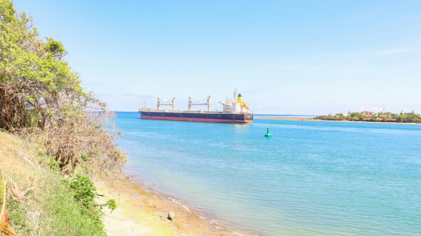 a large cargo ship in the middle of a body of water