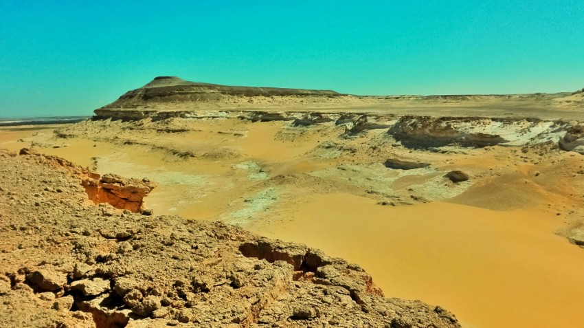 brown rock formation under blue sky during daytime ZPg