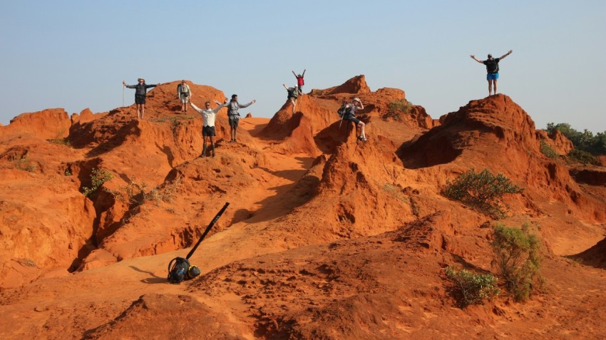 people standing on rocks