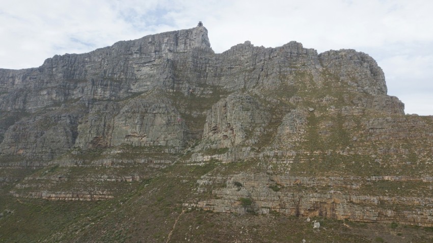 a very tall mountain with a sky background