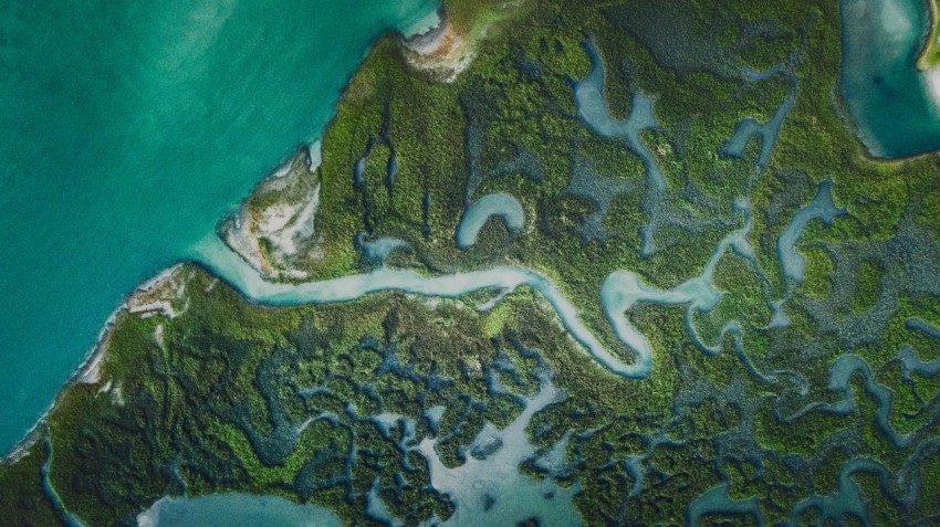 an aerial view of a body of water surrounded by land