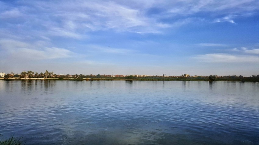 body of water under blue sky during daytime