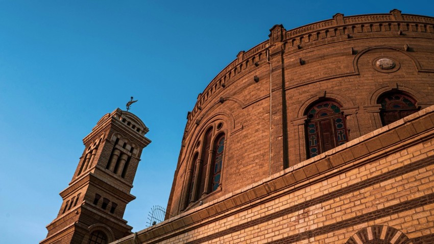 a large brick building with a clock tower