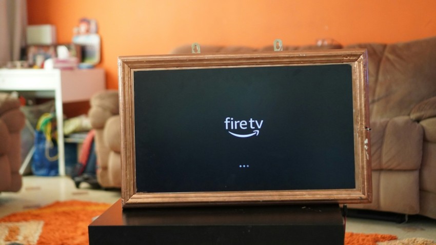 a fire tv sitting on top of a wooden table