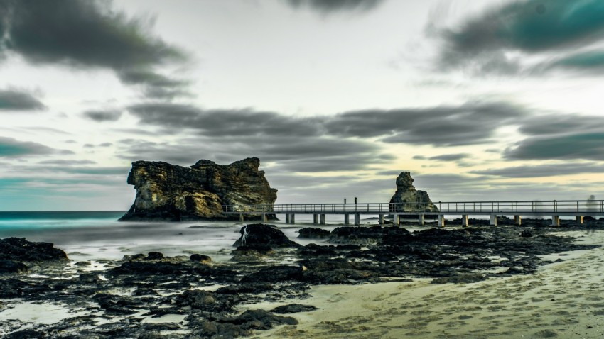 a wooden bridge over a body of water 6nHfXk