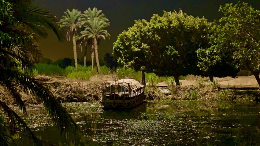 a small boat floating on top of a body of water