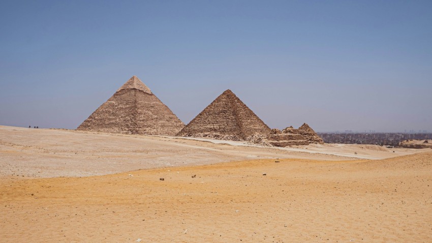 a group of pyramids in a desert