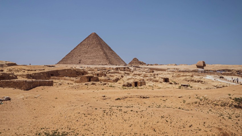 a group of pyramids in a desert