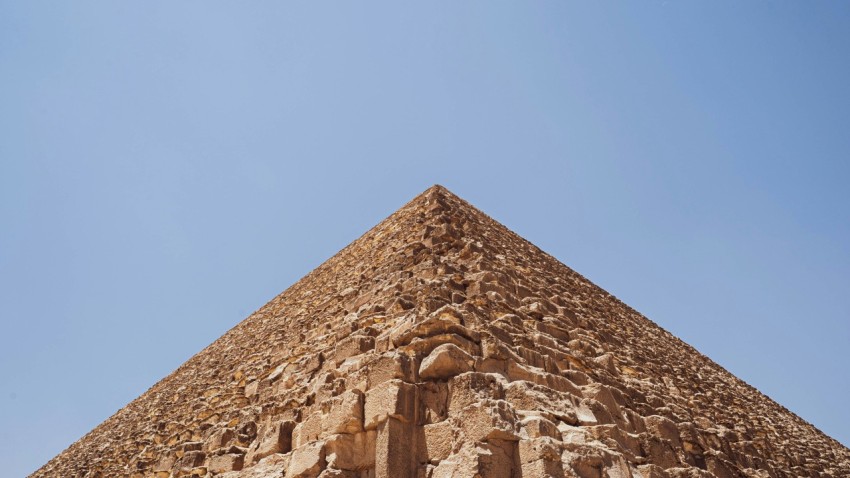 a pyramid with a blue sky